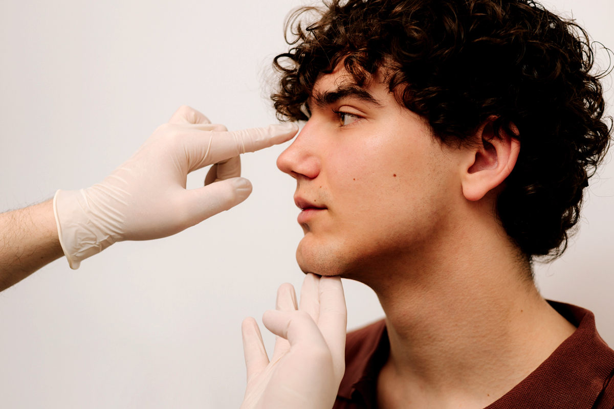 Young man deciding on septoplasty surgery